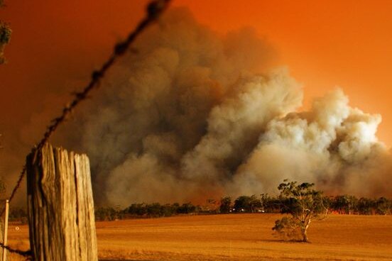 Smoke billows from the Churchill bushfire in the Gippsland region of Victoria