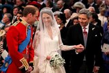 LtoR Prince William smiles at his bride Kate Middleton