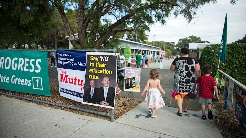 A voter walks into a polling station at Doubleview near Perth on April 5, 2014.