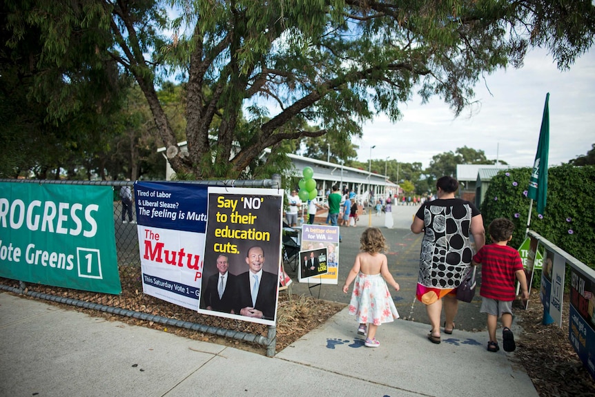 A voter walks into a polling station at Doubleview near Perth on April 5, 2014.