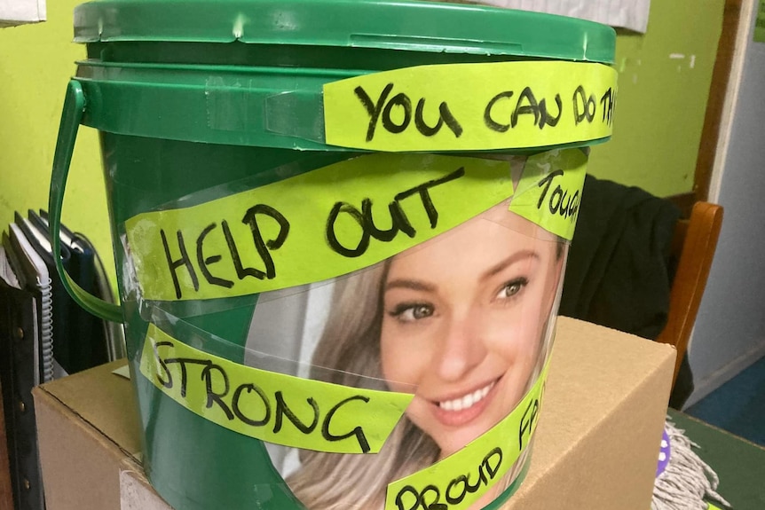 Plastic bucket with a photo of a young truck driver on the front