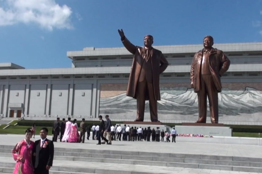 Two statues of men in Pyongyang, North Korea