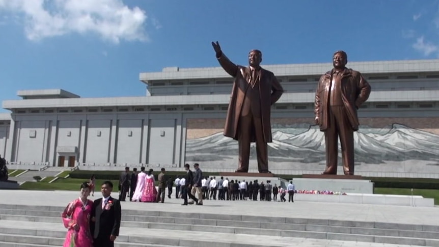 Two statues of men in Pyongyang, North Korea