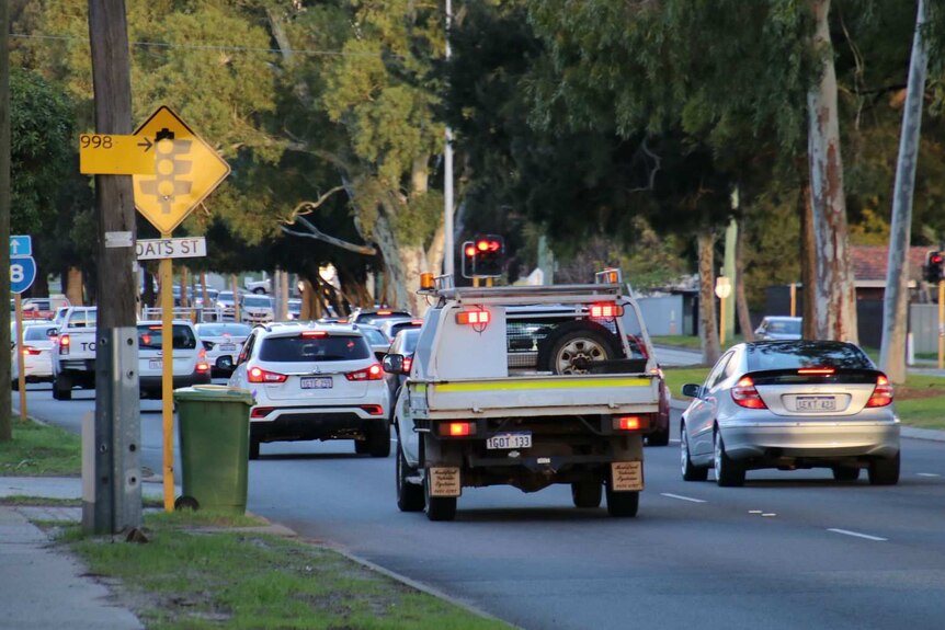 Traffic stopping at a set of lights on Orrong Road.