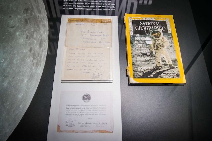 A handwritten letter and National Geographic.