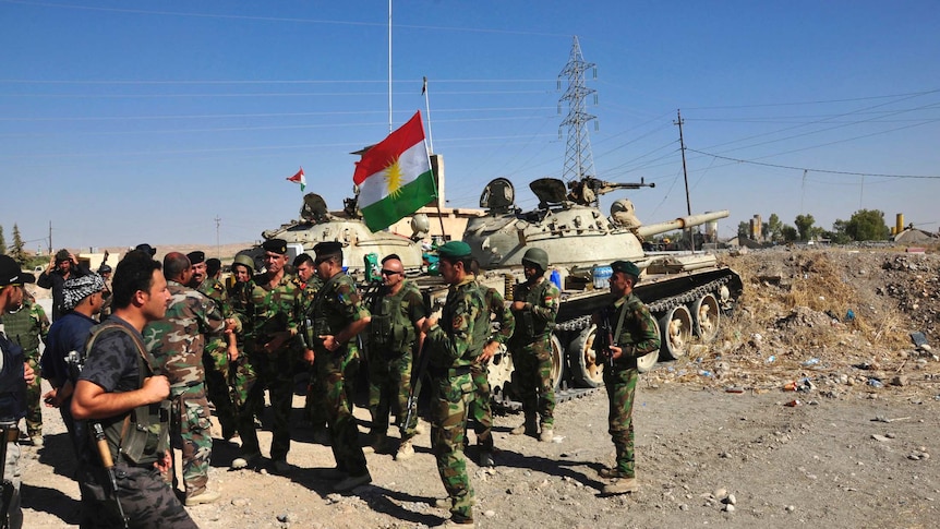 Members of the Kurdish security forces after clashes with militants of the Islamic State