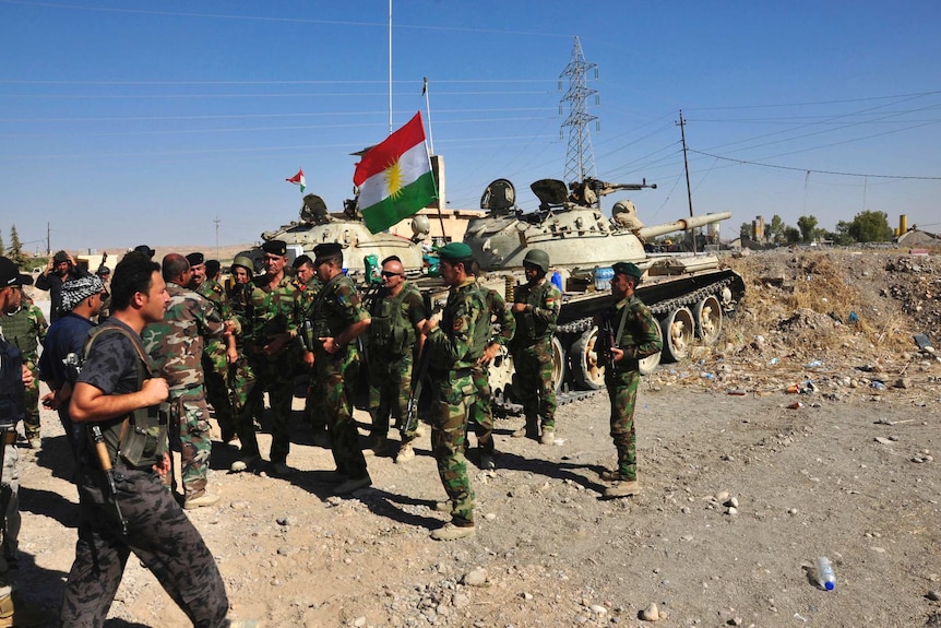 Members of the Kurdish security forces after clashes with militants of the Islamic State