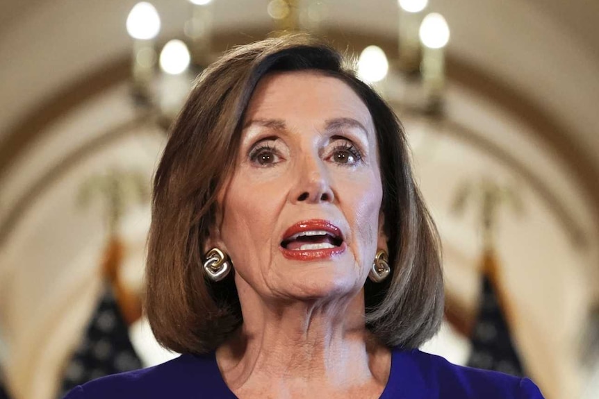House Speaker Nancy Pelosi speaks with a sombre face
