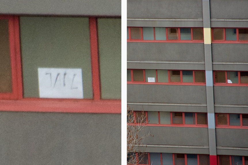 You view a diptych of the same image of a tower carrying posters reading 'jail', with the image on the left zoomed in.