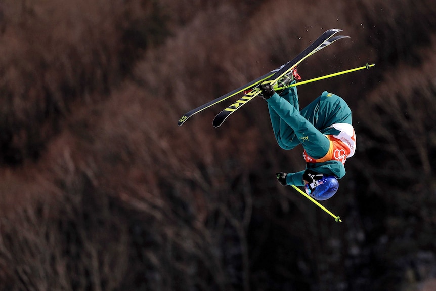 Russ Henshaw doing a somersault in the air during the men's slopestyle qualifying at Olympic Winter Games.