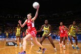 Joanne Harten catches the ball for England against Jamaica at the Netball World Cup.