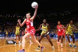 Joanne Harten catches the ball for England against Jamaica at the Netball World Cup.