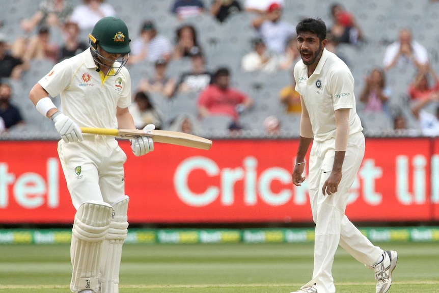 Jasprit Bumrah celebrates as Marcus Harris looks to the ground after his dismissal at the MCG