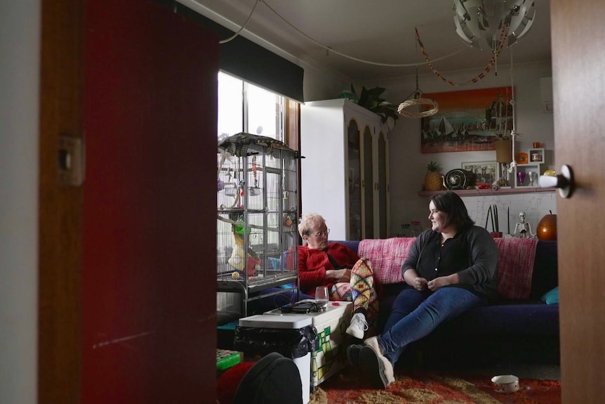 Ashley May with her mother in the living room