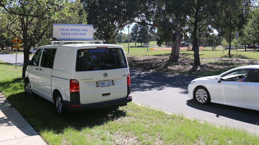 A white van with a mobile camera sign.