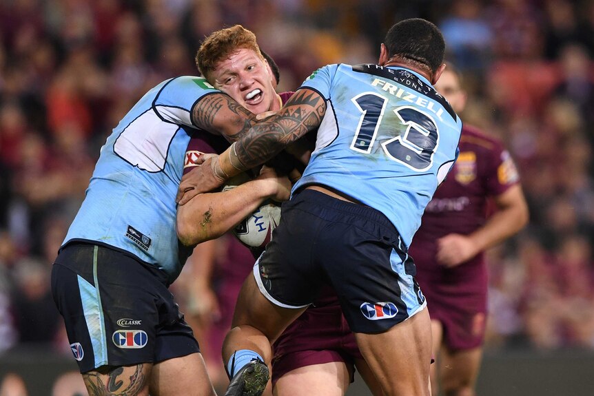 Dylan Napa of the Maroons is tackled by the Blues during State of Origin I at Lang Park in Brisbane on May 31, 2017.