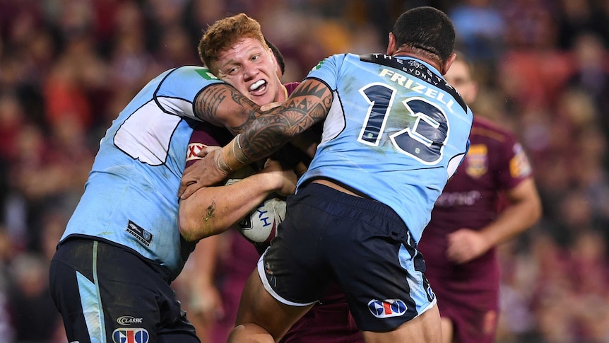 Dylan Napa of the Maroons is tackled by the Blues during State of Origin I at Lang Park in Brisbane on May 31, 2017.