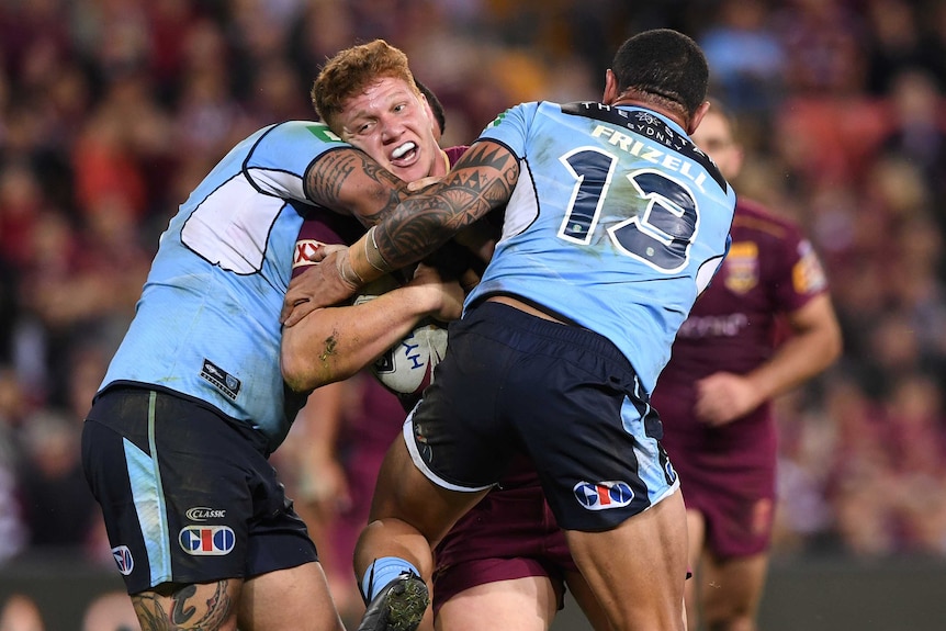 Dylan Napa of the Maroons is tackled by the Blues during State of Origin I at Lang Park in Brisbane on May 31, 2017.