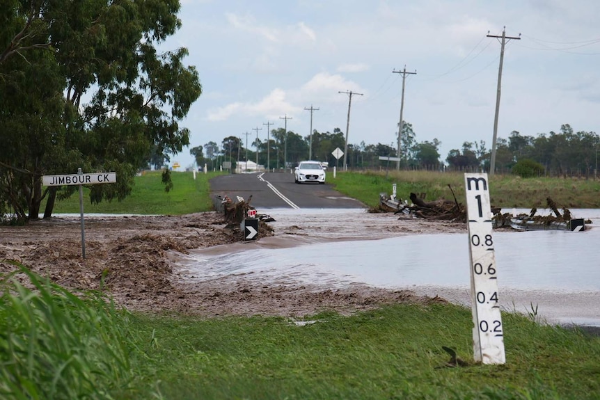 Floodwaters from Jimbour Creek cut off the road to Jandowae.