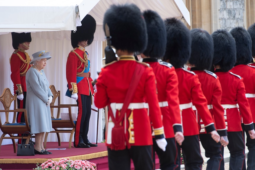 Queen Elizabeth II and the Duke of Kent watch a military ceremony to mark her official birthday at Windsor Castle.