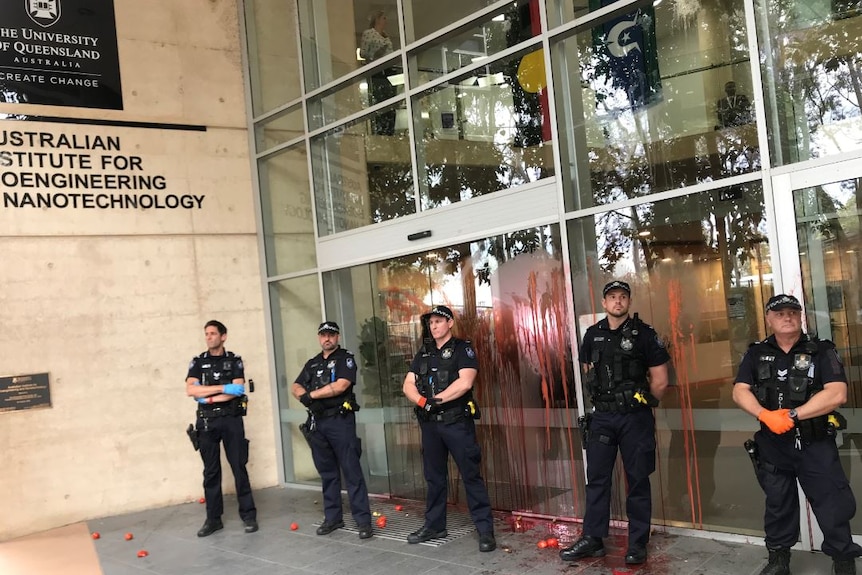 Police stand outside a building