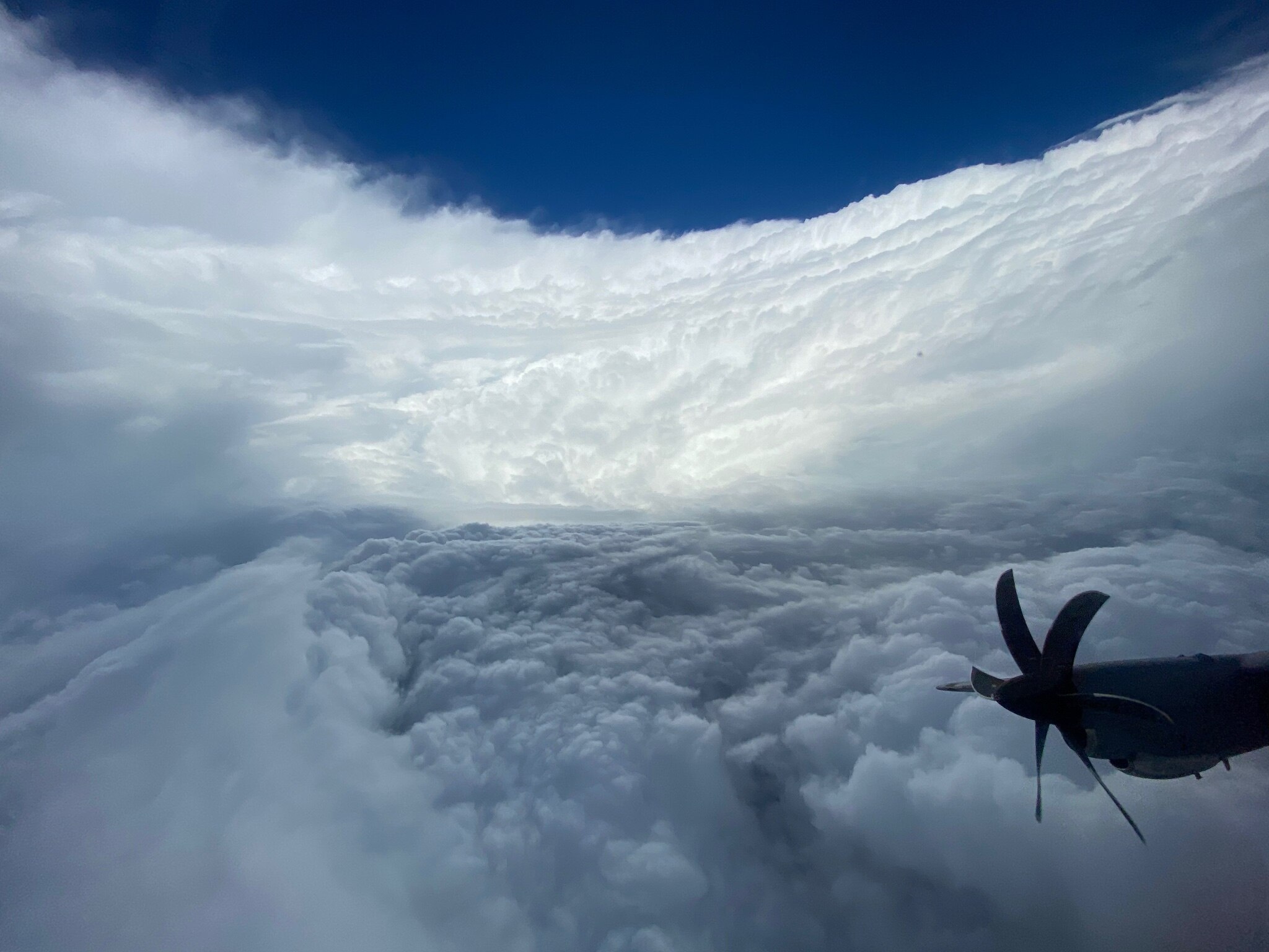 Tall white cloud walls look like a stadium.