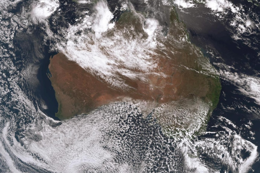 Satellite image of Aus. Deep clouds over N WA. Speckled clouds over south east. 