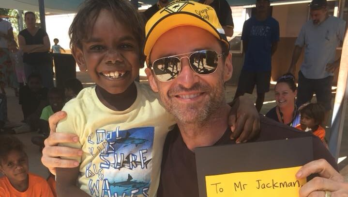 Jackman poses with a student at La Grange Remote Community School.