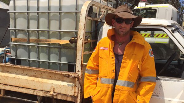 Tom Butcher, who died in the Esperance bushfires, pictured leaning against a ute.