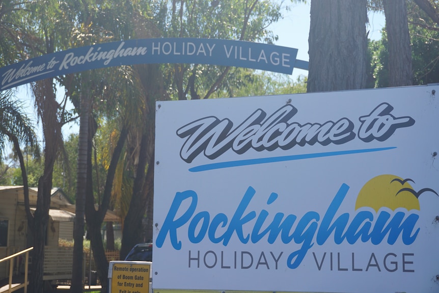 A sign that says Rockingham Holiday Village. 
