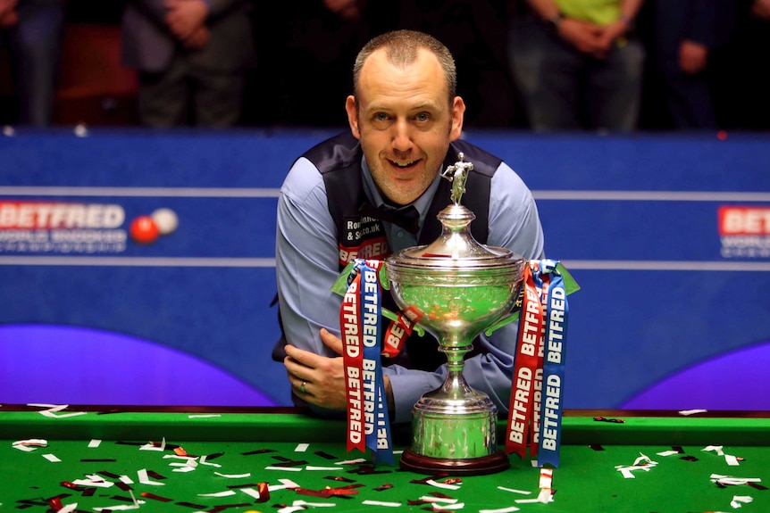 Mark Williams celebrates with Snooker World Championship trophy