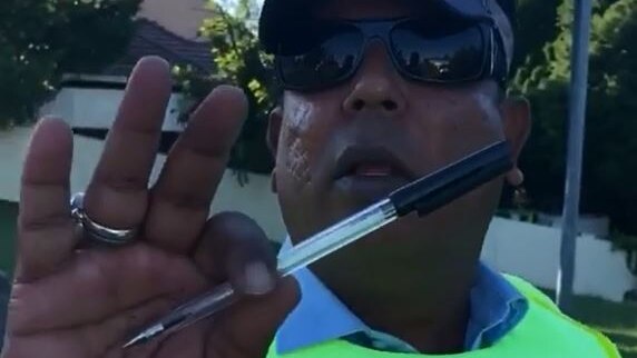 police officer with pen and sunglasses