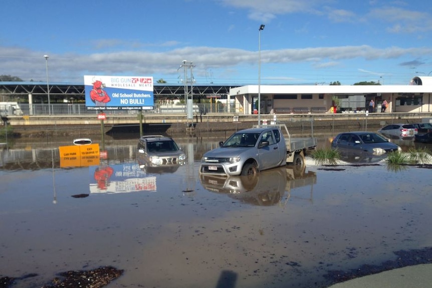 Cars parked in the Beenleigh area are beginning to be submerged.