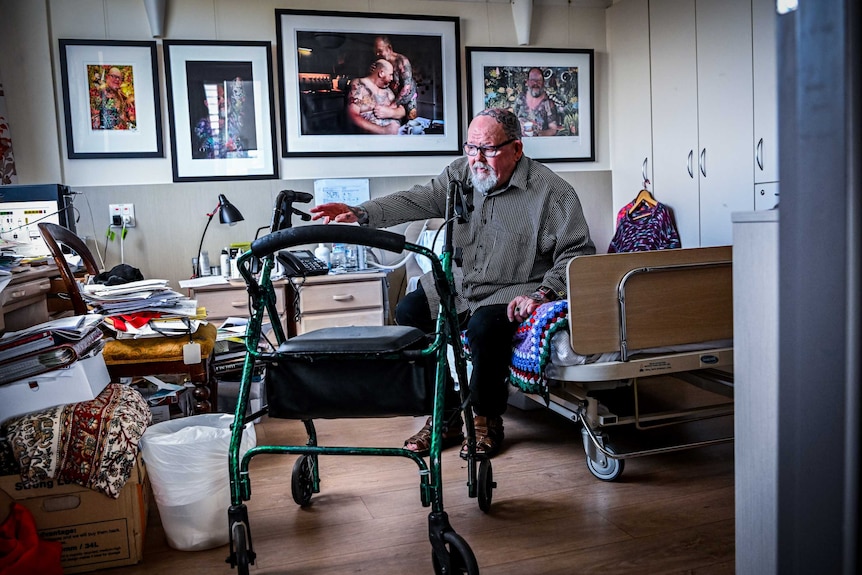 Geoffrey Ostling's room in aged care features artistic photographs of himself, including one where he embraces another man.