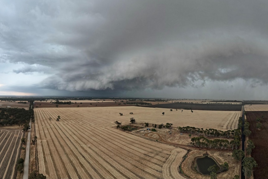 Dark clouds moving across a farming landscape. 