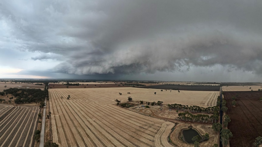 Dark clouds moving across a farming landscape. 