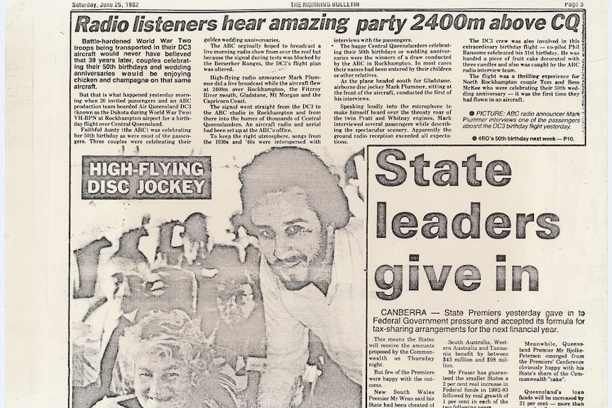 Newspaper clipping with headline 'radio listeners hear amazing party 2400m above CQ'.