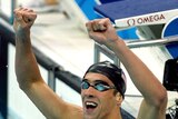 Michael Phelps celebrates winning the men's 400m Individual Medley