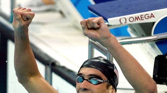 Michael Phelps celebrates winning the men's 400m Individual Medley