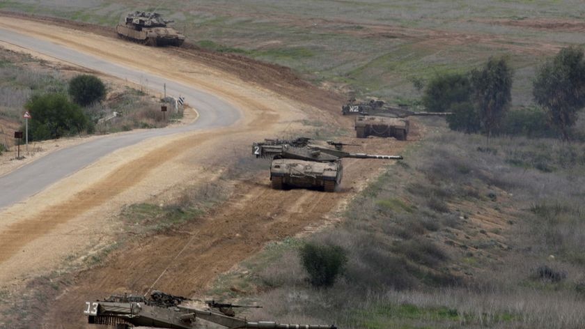 Israeli tanks roll near the border with the northern Gaza Strip
