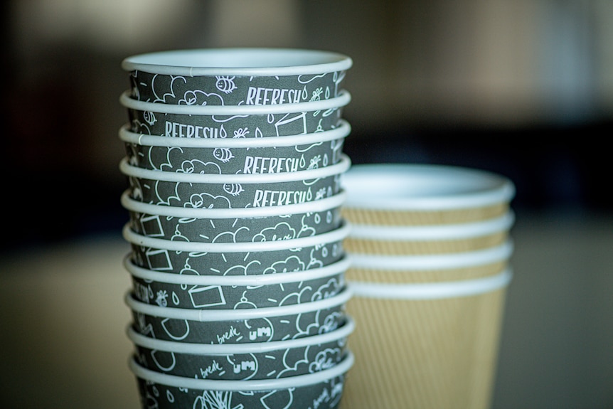 A stack of takeaway coffee cups.