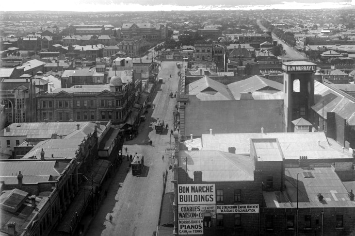 Black and white photo of the Bon Marché buildings and Barrack Streets, seen from the Town Hall tower, in 1923.