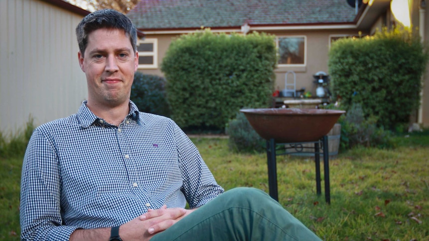 A man in his backyard in a regional area