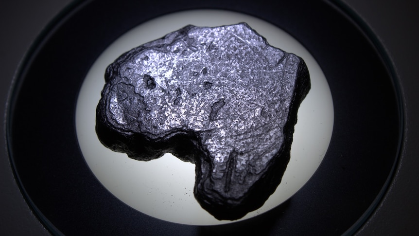 A lump of silvery graphite