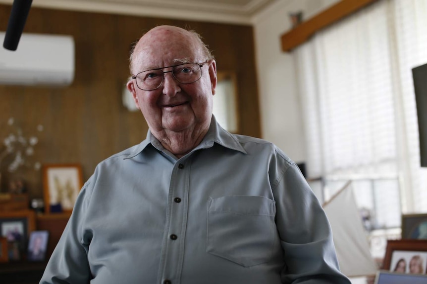 Leigh Robinson, 88, sits in his home at Paynesville, Victoria.