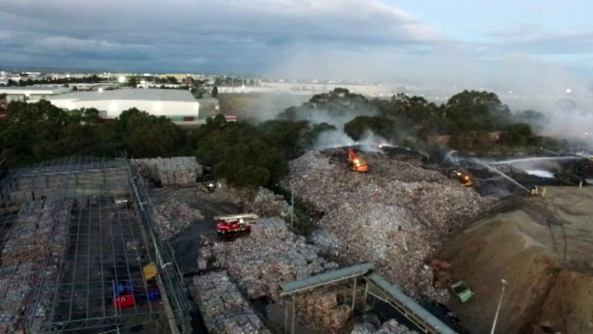 An aerial image of a fire at a recycling plant.