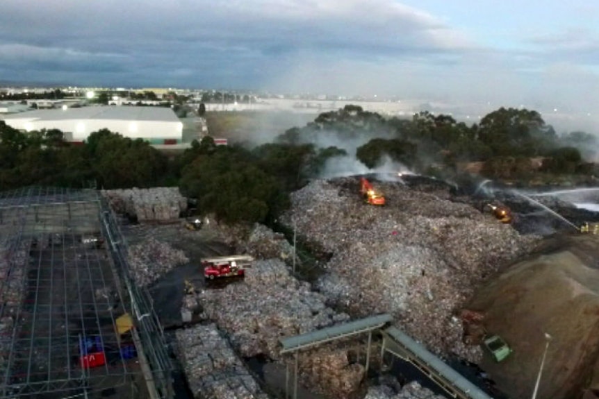 An aerial image of a fire at a recycling plant.