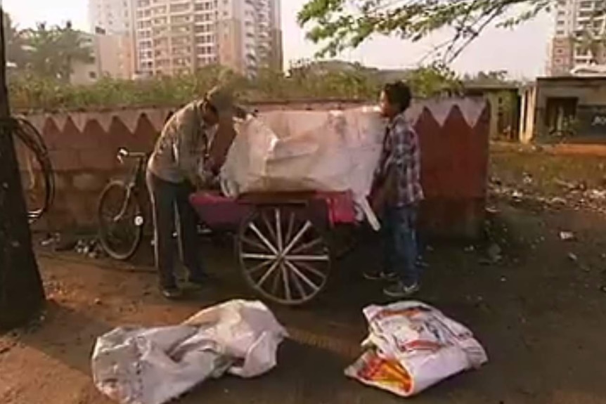 Abdul and his son Roni, Indian 'rag pickers'