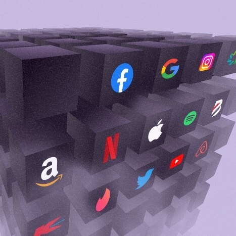 Many 3D black boxes with recognisable brand logos on them including Facebook, Netflix, Apple, and Twitter on a purple background
