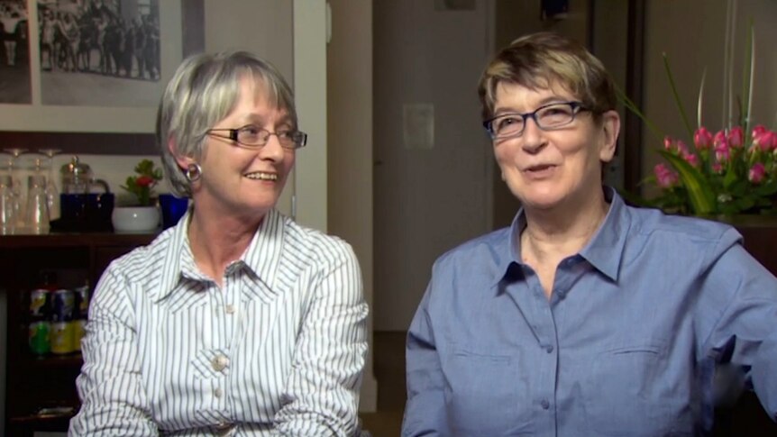 Two middle-aged women sit in interview